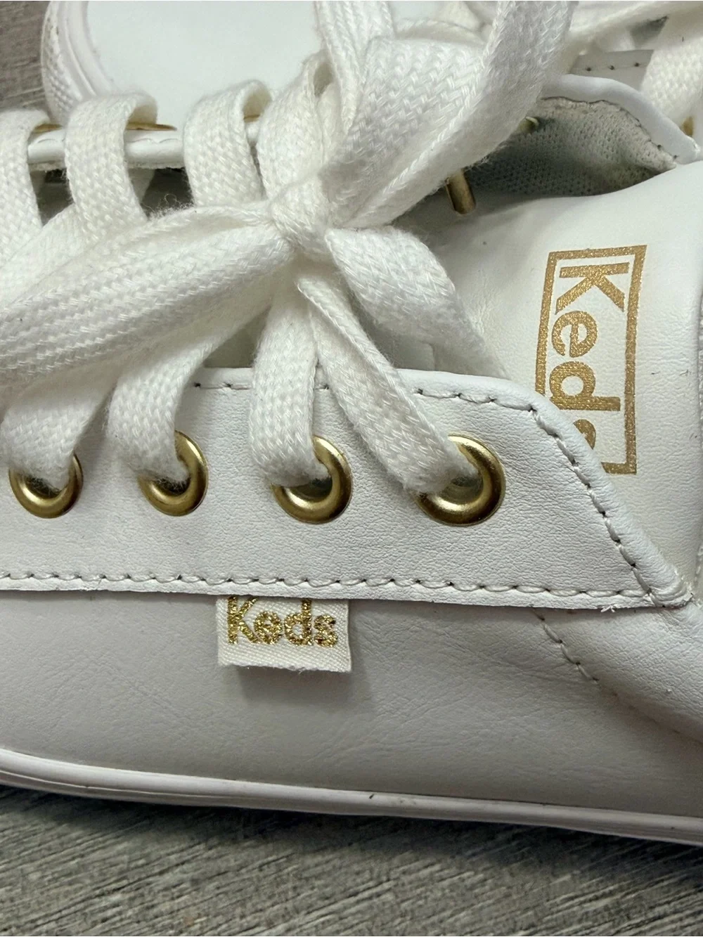 Keds White Sneakers with Gold Eyelets